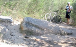 This is an example of track widening. The original path wasleft between the rocks or over the rock. The unfortunate widening on the right takes the challenge out of the singletrack and creates a new watercourse.