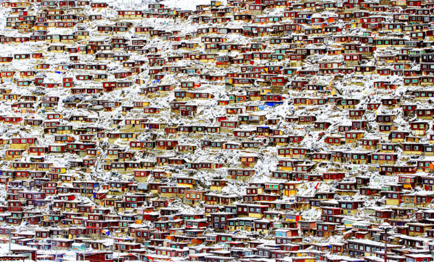 “Larung Gar Buddhist Academy, China”. Red houses of the lamas and nuns at this Buddhist academy in Sichuan province, China, after heavy snowfall. Honourable mention: Architecture. (Photo by Qingjun Rong/SIPA Contest)