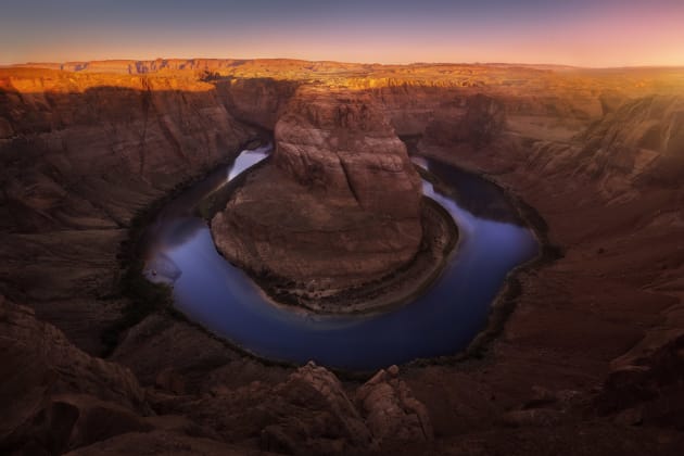 Horseshoe Bend in Arizona is an incredible site. I had photographed it sunset the night before but with swarms of people, I didn’t get that peaceful felling I enjoy so much about shooting alone. So I returned at sunrise not quite expecting the light to do what it did! What a beautiful morning!
Canon 5D mkII, Canon 16-35mm F2.8 II @ 16mm, 1/10s @ f13, ISO 50.