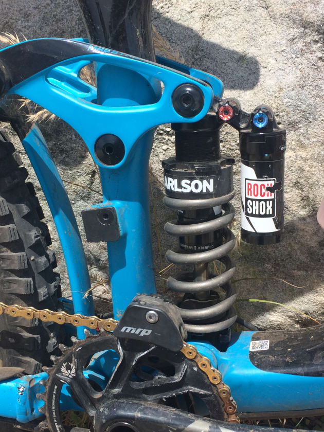 Josh is running a 450lb coil from Super Alloy Racing. Running a coil adds 400-500g compared to an air shock but he prefers the more consistent performance and quieter ride feel that this setup provides.