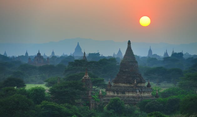 Dust and haze in the atmosphere create a separation of the different layers of trees and temples on the plains of Bagan, Burma. A telephoto also enabled me to reach across an uninspiring foreground to focus on the distant temples. Nikon D800E, 70-200mm f/2.8 lens, 1/180s @ f5.6, ISO 400.