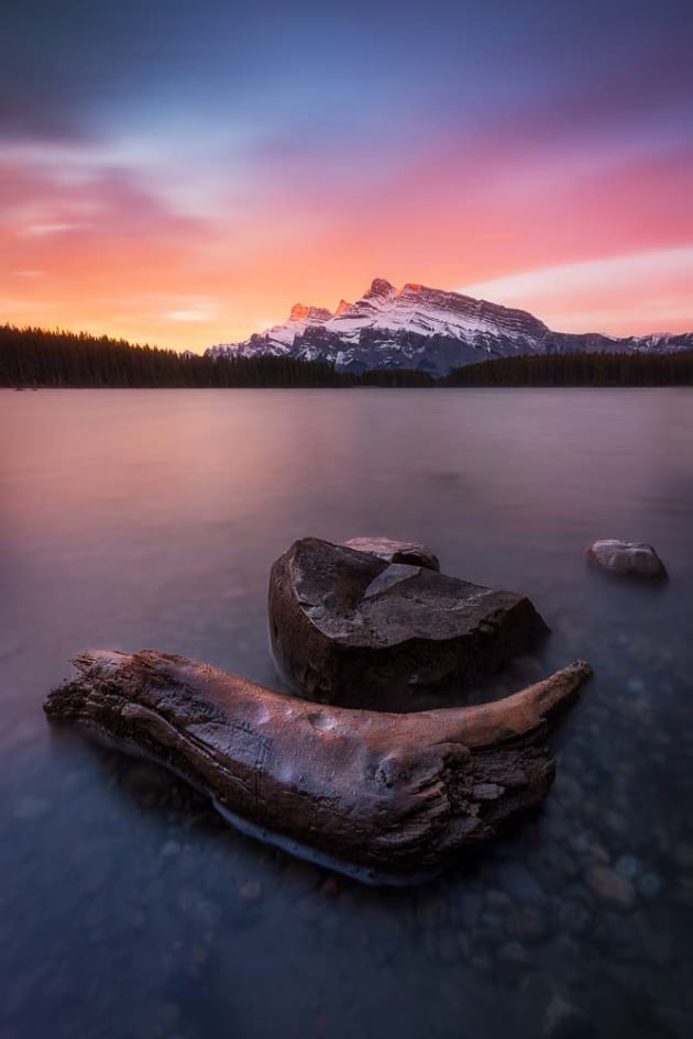 A blazing dawn from Two Jack Lake overlooking Mount Rundle. Canon EOS 5D MKIV, 16-35mm f4 lens, 60s @ f/11, ISO 100, tripod, polarising filter, 4-stop soft-edge GND, 6-stop ND filter. Colour and contrast adjustments, 'light painting' in Lightroom CC and Adobe Photoshop CC.