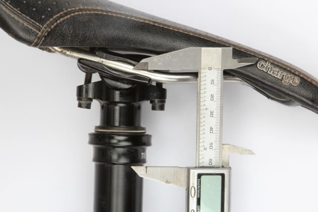 Measuring the minimum ride height on the post; a more compact dimension will help if your bike has a tall seat tube.