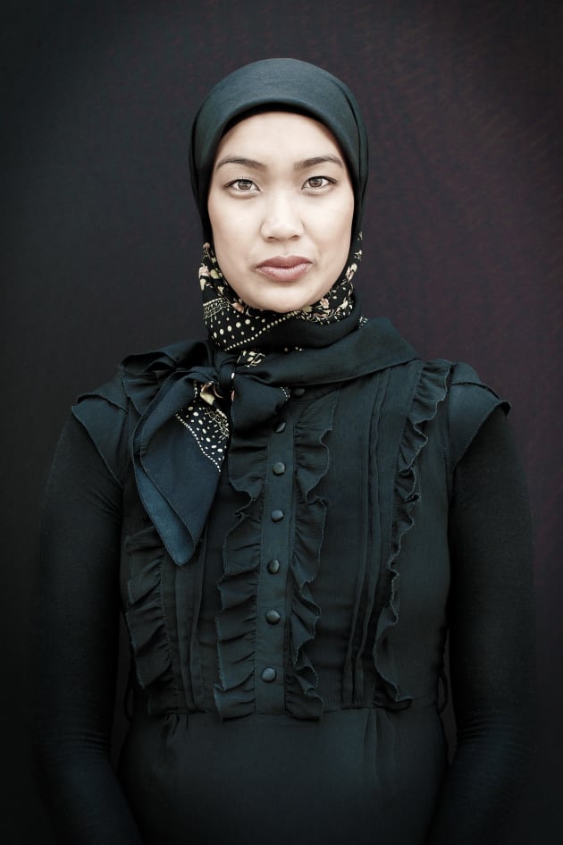 Mastura, 2016 by Brett Canet-Gibson. Highly Commended in the National Photographic Portrait Prize 2017.
This portrait of Australian-born Muslim mother of three, Mastura, was made on the city streets of Perth using natural light and a portable backdrop. Mastura works as a lifestyle and fashion blogger and marketing consultant; she is also a full-time mum. When this image was taken Mastura was only weeks away from giving birth to her third child.