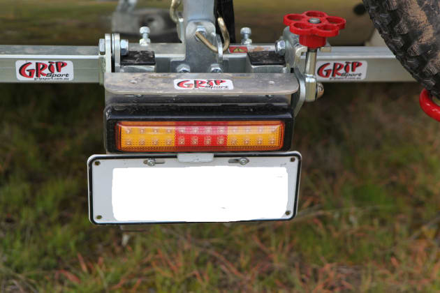 The optional LED number plate mount is a handy addition. Loosening the red knob on the right allows the rack to tilt.