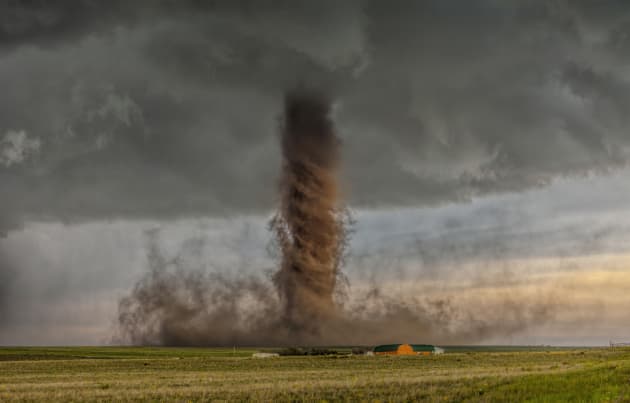 This shot won James Smart the National Geographic Photo of the Year. A rare and jaw-dropping anti-cyclonic tornado touches down in farmland, narrowly missing a home by a few hundred yards. “This tornado was fairly slow moving so we had time to get in position for a great shot and see the power in the rotation of the funnel.” Canon EOS 5D Mark II, 70-200mm lens @ 70mm, 1/90sec @f4, ISO 100.