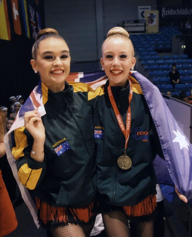 Tayla Minchinton (right) with friend Kyla Borghero at the 2016 IDO World Dance Cup in Korea.