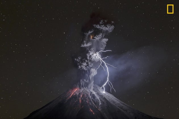 Photo and caption by Sergio Tapiro Velasco/National Geographic Travel Photographer of the Year. Grand Prize and 1st Place, Nature: The power of nature.
Powerful eruption of Colima Volcano in Mexico on December 13th, 2015. That night, the weather was dry and cold, friction of ash particles generated a big lightning of about 600 meters that connected ash and volcano, and illuminated most of the dark scene. On last part of 2015, this volcano showed a lot of eruptive activity with ash explosions that raised 2-3 km above the crater. Most of night explosions produced incandescent rock falls and lightning not bigger than 100 meters in average.