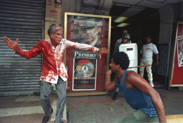 A supporter of Panamanian dictator Manuel Noriega attacks elected Vice President Guillermo (Billy) Ford in Panama City, May 10, 1989. President George Bush used the photographs as one of the justifications for the US invasion of Panama when he ad-dressed the nation. © Ron Haviv/VII Photo.