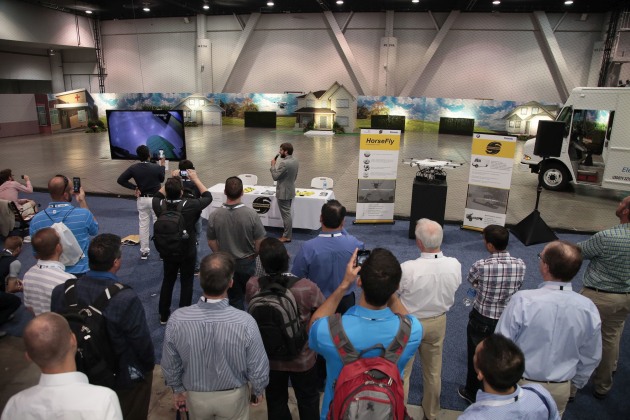 Drone delivers parcel as Pack Expo visitors watch the live demo.