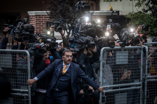 © Chris McGrath. Nominee - World Press Photo of the Year. An unidentified man tries to hold back the press as Saudi investigators arrive at the Saudi Arabian Consulate in Istanbul, Turkey, amid a growing international backlash to the disappearance of journalist Jamal Khashoggi.