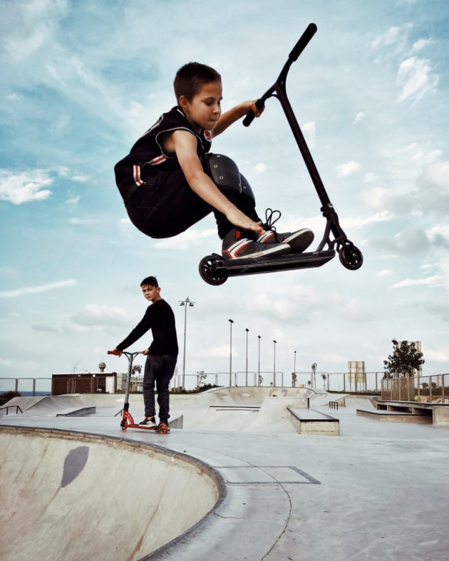 2nd Place – Children: Air by Dina Alfasi, Israel
“Part of a series taken at a skatepark. I was captivated by these young children, who spend hours, training continuously to improve and achieve greater things.”
Location: Skate park, Haifa, Israel. Shot on iPhone X