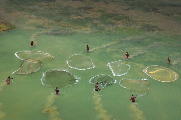 Bring Home the Harvest.	Debdatta Chakraborty, India. The Fishermen	Silabati is a perennial river, only getting inundated when water is released from the nearby dam, Medinipur, West Bengal. Villagers try their luck for their silver catch on one such occassion.