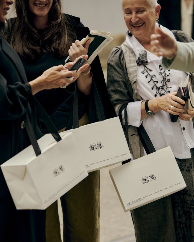 FSC-certified paper gift bags with woven handles and logo.