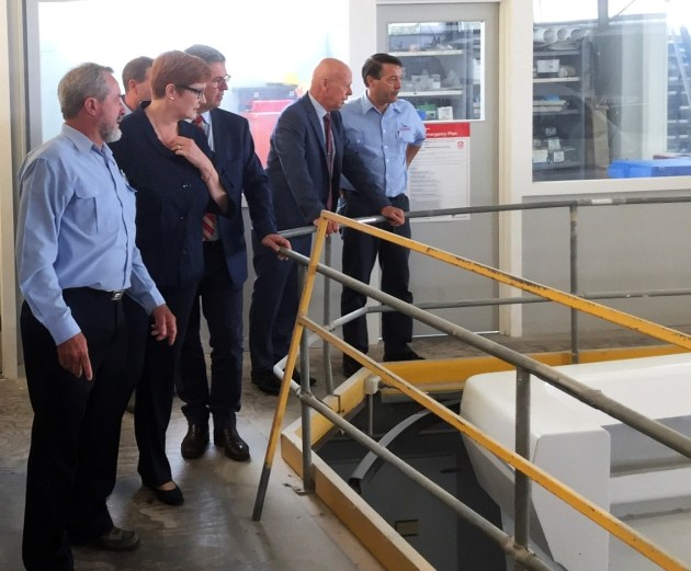 Steber International's Alan Steber (left) shows Senator Marise Payne and David Gillespie, member for Lyne, around the Taree boat building facility.