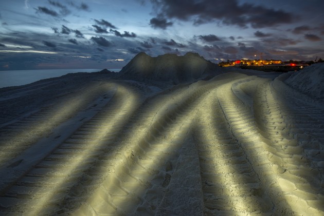 In areas of Florida beach nourishment is still used to beatify the beaches and some of which are used for nesting. To create an interesting image of this element of the photographic essay, I waited until nightfall and light-painted the excavator tracks, which looked similar to turtle tracks.