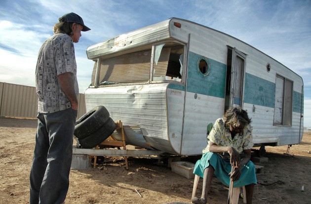 Urandangie, Queensland. A picture of despair - Norman and Mavis Wilde outside their wrecked van home in the far western Queensland community of Urandangi. The community of nearly 100 has no power, no water, no sanitation and many children sleep on ragged mattresses in the open. Nikon D2Xs, Nikkor 17-35mm lens at 18mm, 1/800s @ F5.6, ISO 200.
