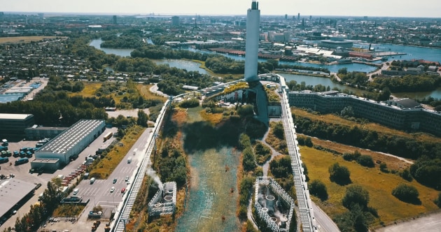 The CopenHill EfW plant in Copenhagen, which features a roof-top ski slope and hiking trail for the local community to use.