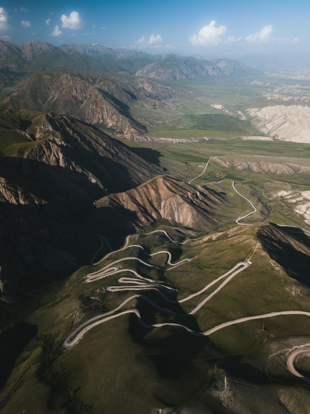 Ak-Baital Pass 4655m, Tajikistan. The second highest highway pass in the world and one that only a handful of crazy truck drivers tackle without acclimatisation. The winding dirt road was the perfect element to break up the bleak surroundings. DJI Mavic Pro. 1/100s @ f/2.2. ISO 131. +0.34EV.