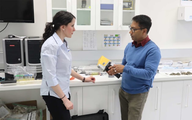 Dr Debashish Mazumder holds the Olympus FXS handheld scanner, provided by Olympus. Image: ANSTO.