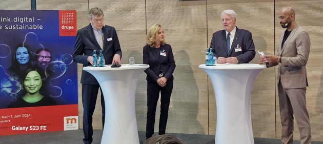 drupa ready to show future (l-r) Wolfram Diener, CEO, Messe Centre; Sabine Geldermann, director, drupa; and Dr Andreas Plesske, president, drupa; with the moderator Chris Brown