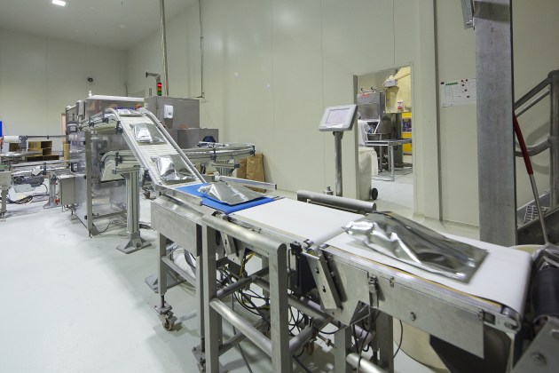 In the plant: The Yatala site’s fill and pack line before products reach the x-ray.