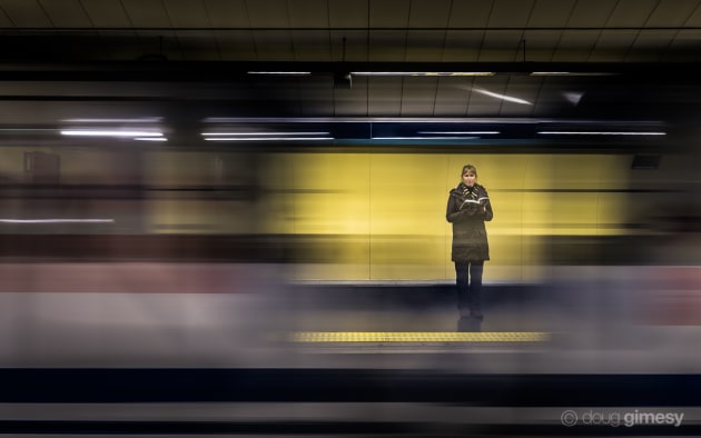 Taken in a Madrid train station, the key to this photo was both exposure length and timing. Using the gap between the two passing carriages as a virtual shutter, plus a relatively slow exposure, made the subject more visible compared to the rest of the scene. Nikon D750, Sigma 35mm f/1.4 lens, 1/3s @ f/6.3, ISO 100.