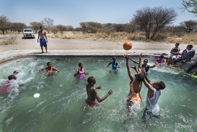 Children attending a bush camp run by Cheetah Conservation Botswana in the Kalahari (30km outside Ghanzi) take a refreshing break from the more formal activities of the day. My goal was to capture both a sense of place and freeze the action, so I chose the wide focal length of a 16mm and a fast shutter speed. Nikon D750, 16-35mm f/4 lens. 1/1000s @ f/9, ISO 560.