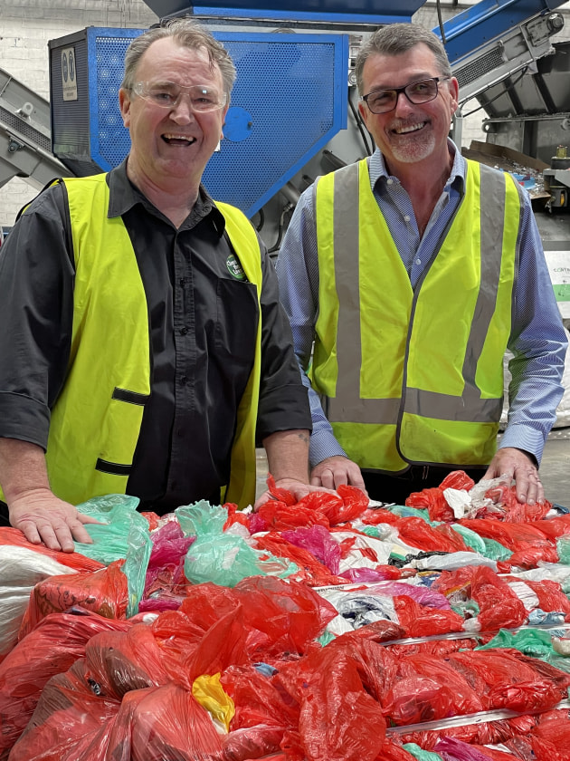 CLG CEO Joe Foster (right) with Steve Morris, director of the Close the Loop division, with soft plastics collected through REDcycle for recycling at the company's Melbourne facility.