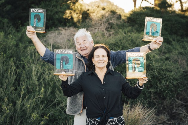 Greenskin Wine founders Mike Davies and Kim McKee with winning trophies for Best Alternative/Sustainable Package Design Award and People's Choice Award 2022 and 2023.