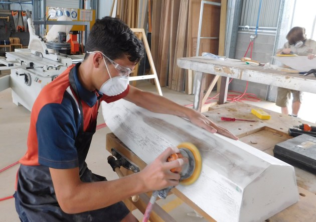 Students at Livingstone Christian College work on their own projects to learn the basics of boat building.