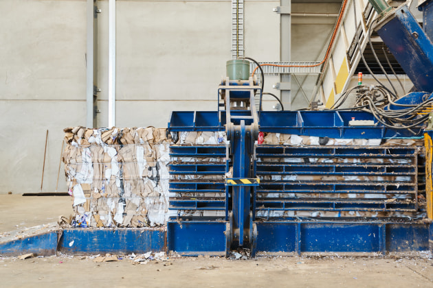 The 180 HP Godswill GB-1111F refurbished baler includes a feed conveyor and ramp, supplied new by Material Recovery Solutions