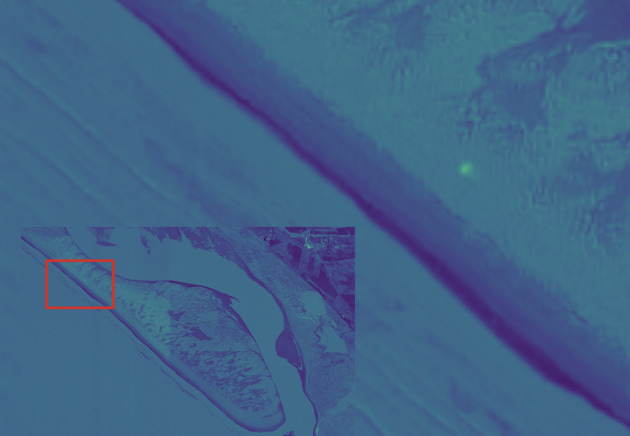 A yellow spot indicating plastic on the beach, identified from a satellite image using the tool