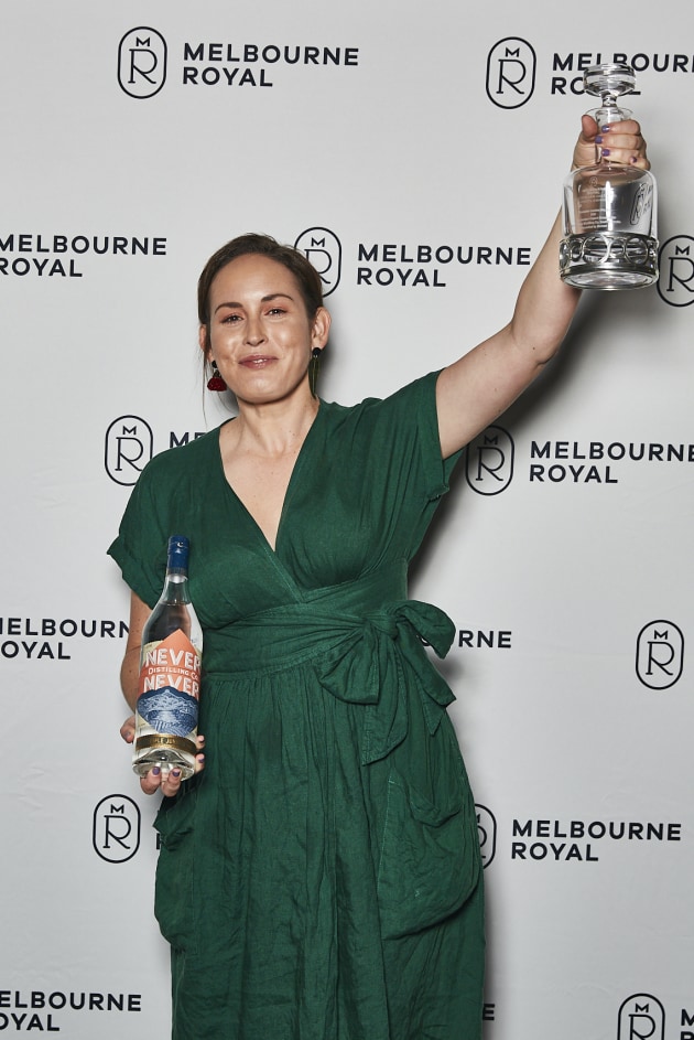 Never Never Distilling Co. brand ambassador Shae Chamberlain accepting the distillery's awards at the Australian Distilled Spirits Awards. (Source: Melbourne Royal)