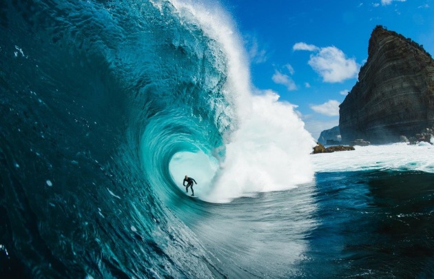 © Stu Gibson. Beauty and the beast, Shipstern Bluff. Mikey Brennan. This day was a big tow day in the morning the light popped for about 20 mins then it went back to cold and ugly Shippies.