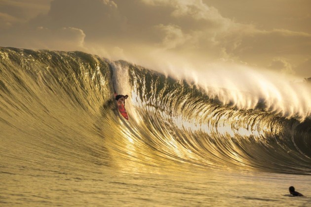 © Ted Grambeau. Gold Nias. A golden moment as big wave surfer Mark Healey takes the drop on his 7'6