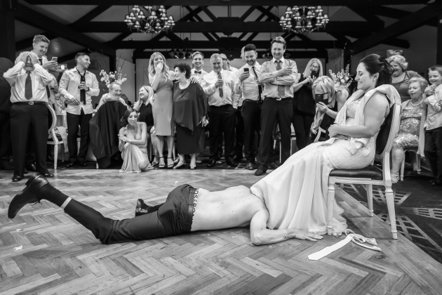 © Alex Kuo. Garter time. Single Shot category featured entry, 
Australasia's Top Wedding Photographers 2021