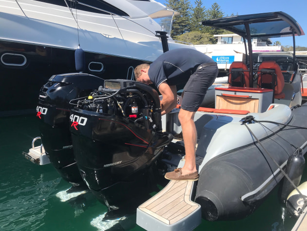 Working on twin twin Mercury Verado 400R outboards.