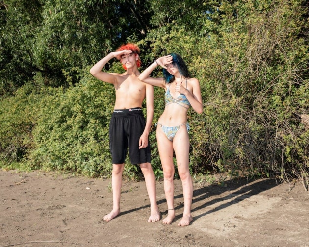 © Adam Ferguson. Sofia Zambrano (18) and Isaiah Vankova (18) stand for a portrait on the bank of the Willamette River near the Sellwood River Front Park in Portland, Oregon, on 27 June, 2021. The Pacific Northwest experienced a heatwave, with the hottest temperatures ever recorded.