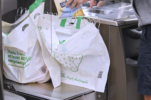 Woolies will run down stock of the 15-cent reusable plastic shopping bags across its Qld stores.