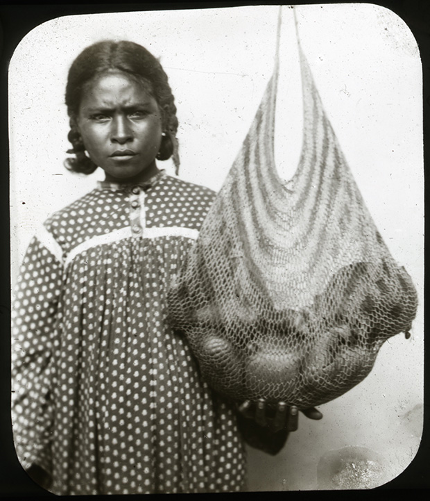Woman with baby in a bilum. 1874-1890, Port Moresby, Papua New Guinea. Photo by Rev W G Lawes. Macleay Museum.