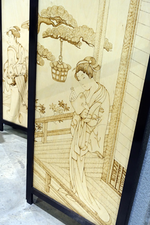 Screen with pyrography by Neville and Alyssa Pike.