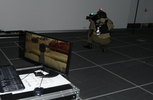 MAJGEN Gus McLachlan led by example at the event and was keen to try his hand engaging with "the enemy" in a 3D immersive simulation demonstrator. Credit: ADM Patrick Durrant