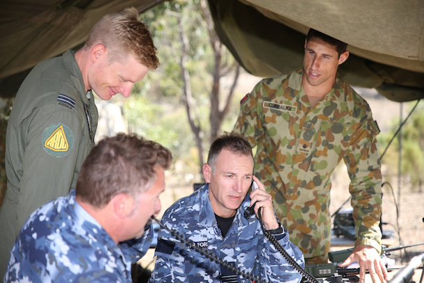 Australian Army soldier Major Khalid El Khaligi and Royal Australian Air Force officers Flight Lieutenants David Doyle (left), Mark Spencer, and Squadron Leader Paul Murphy coordinate air and land assets during Exercise Jericho Dawn at Puckapunyal, Victoria, on 17 March 2016.