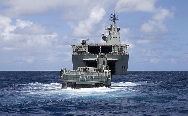 An LCM-1E Landing Craft approaches HMAS Canberra off the coast of Koro Island, Fiji. Credit: Defence
