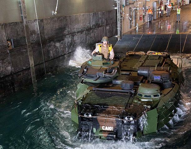 A United States Marine Corps Amphibious Assault Vehicle from USS San Diego 'swims' through the well dock of HMAS Canberra off the coast of Hawaii during Exercise Rim of the Pacific (RIMPAC) 2016.