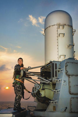 RAN sailor LSET Stephanie Horswood maintains the Phalanx CIWS while deployed aboard guided missile frigate HMAS Melbourne. Credit: Defence