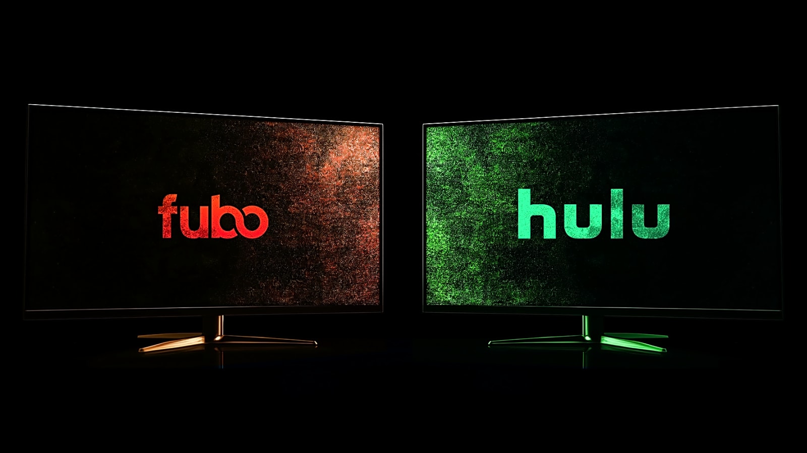 Fubo Logo and Hulu Logo on desktop monitors side-by-side against a black background