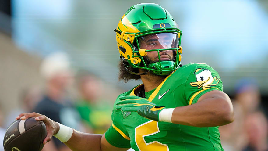 Oregon QB Dante Moore taken off on stretcher after cheap shot