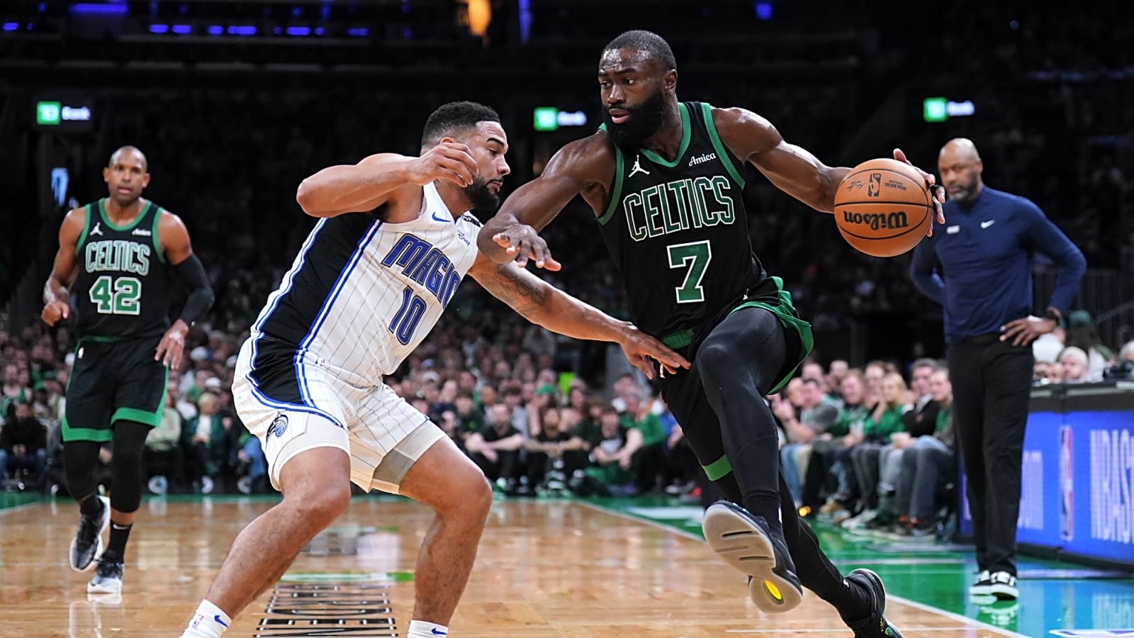 Alt Text: Jaylen Brown of the Boston Celtics drives against Cory Joseph of the Orlando Magic in the third quarter of Game 5 of the 2025 NBA Playoffs first round at TD Garden on April 29, 2025.